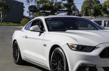 SeaSucker Monkey Bars roof rack system installed on a Ford Mustang