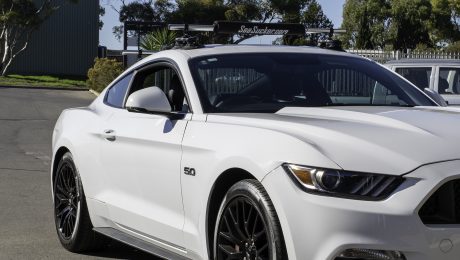 SeaSucker Monkey Bars roof rack system installed on a Ford Mustang