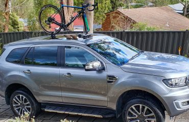 SeaSucker Talon 1-Bike Rack attached to the panoramic roof of a Ford Everest