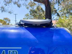 Close up of the removable roof rack on Caravan with surfboard installed