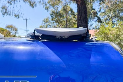 Close up of the removable roof rack on Caravan with surfboard installed