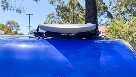 Close up of the removable roof rack on Caravan with surfboard installed